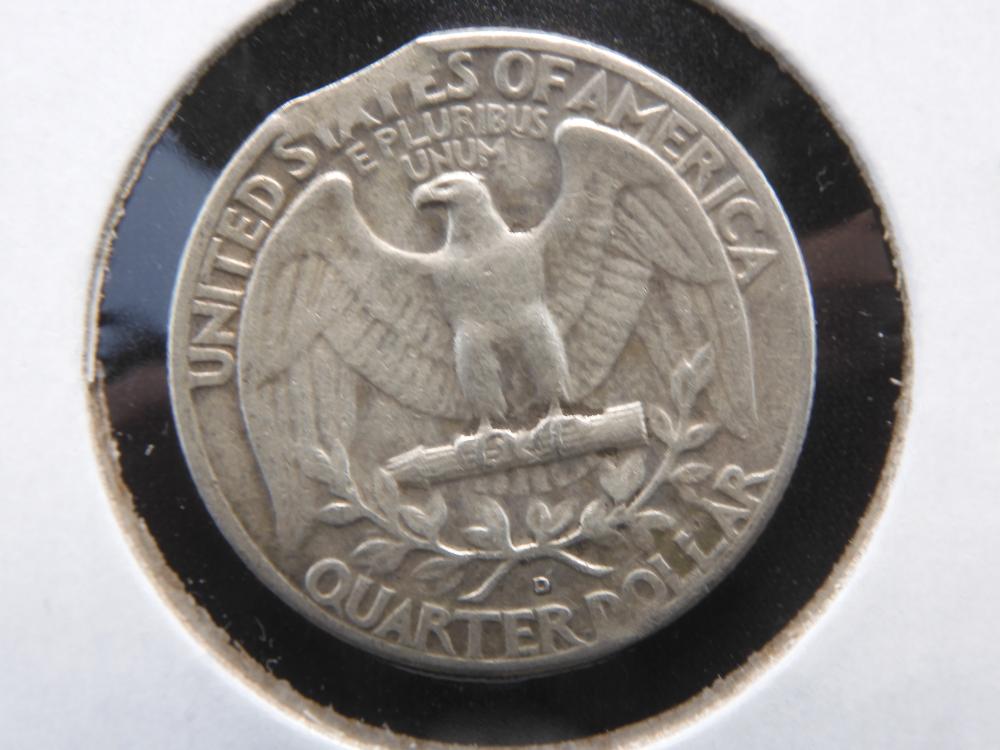 1962 quarter clipped planchet error showing curved section missing from the coin's edge where the blank was punched from overlapping metal strip
